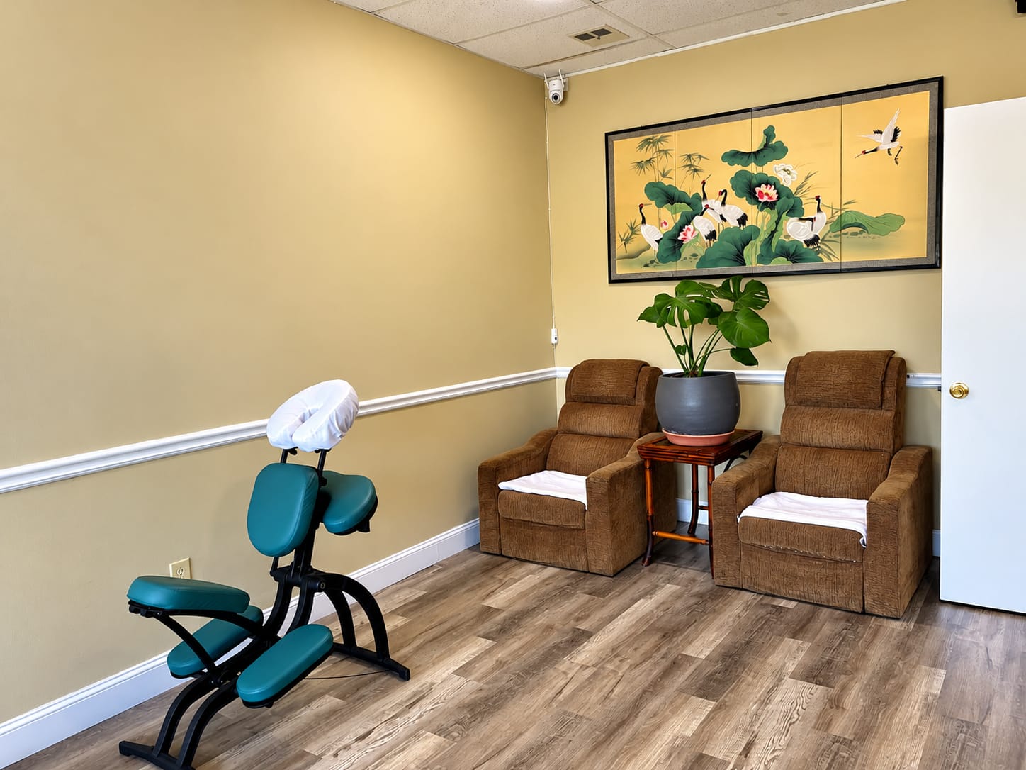 Authentic couples massage room with sunset ocean mural